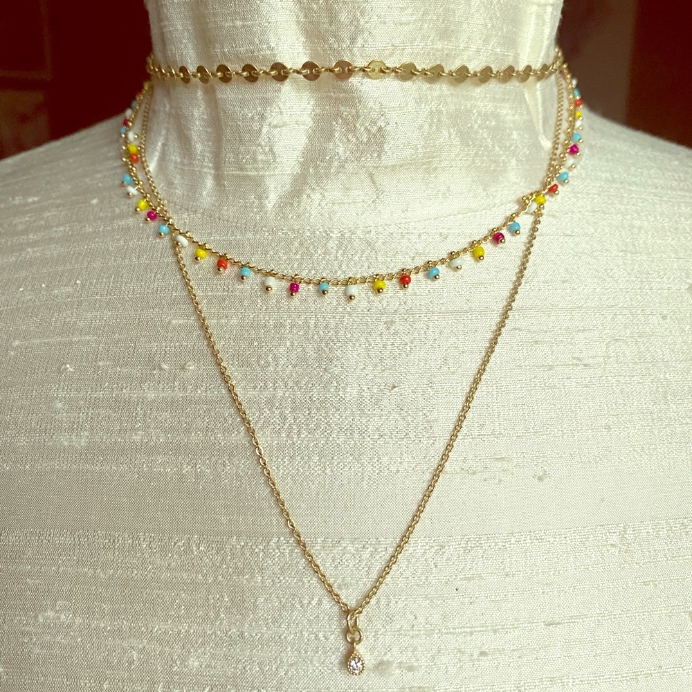 Multi strand gold tone necklace